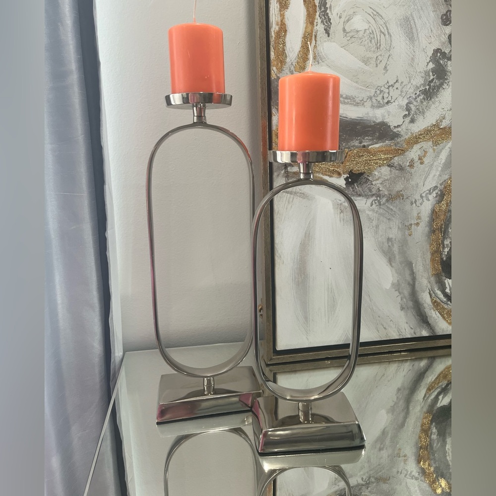 Elegant Silver Candle Holders with Orange Candles